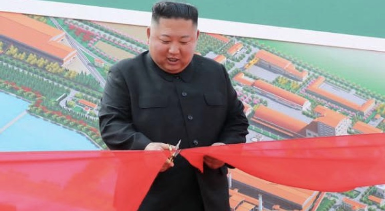 Photo released by KCNA on May Day 2 showing him attending a ceremony to mark the completion of Sunchon phosphatic fertilizer factory in South Pyongan