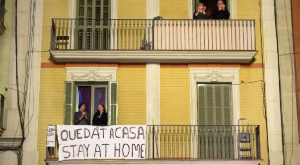 Spaniards outside their balcony 